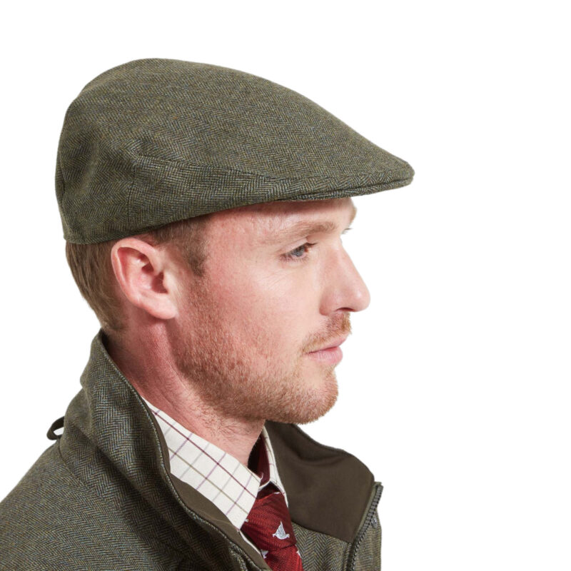 Schoffel Classic Cap in Loden Green Herringbone Tweed on Head